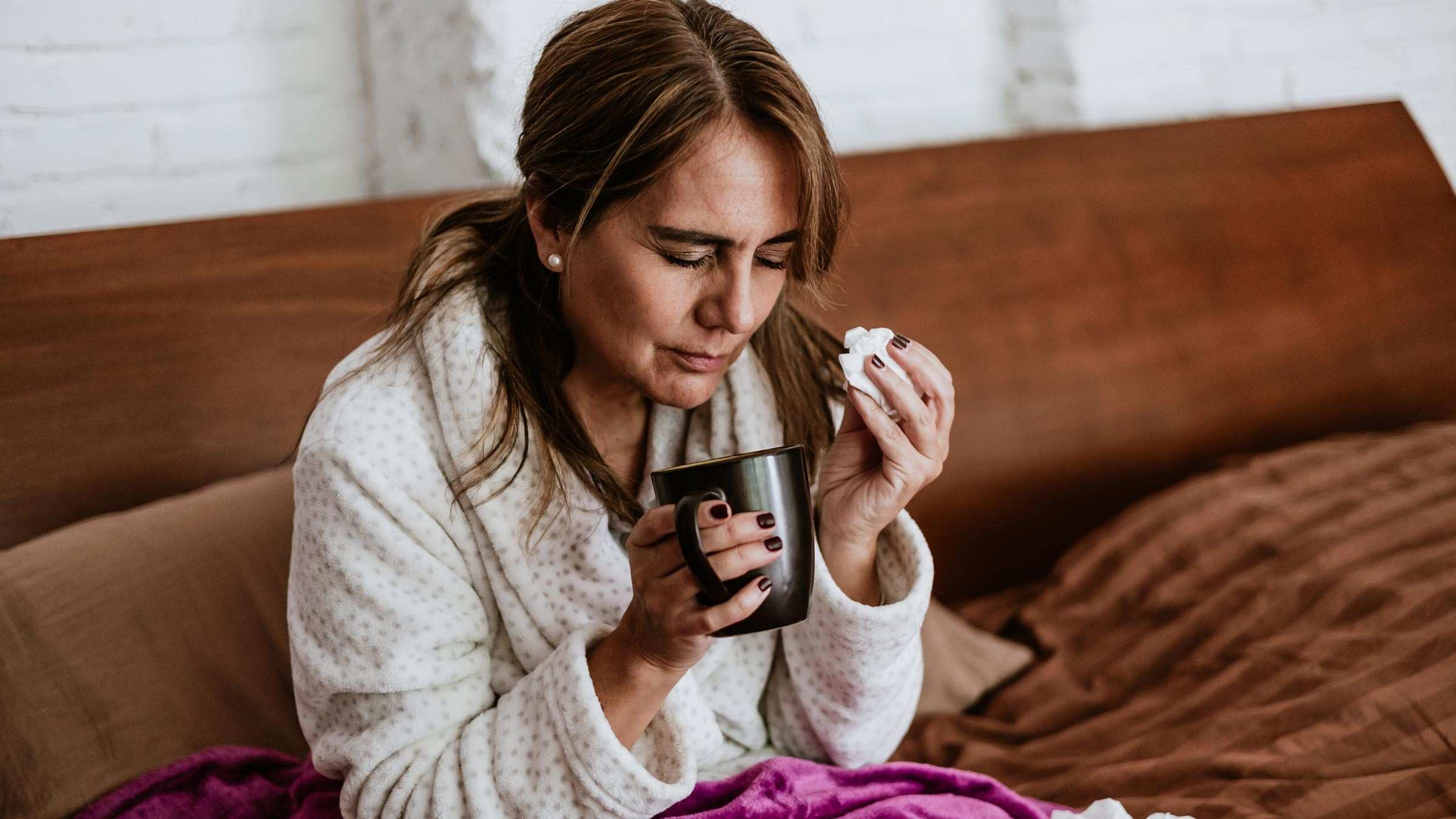 This image about woman holding cup and tissue