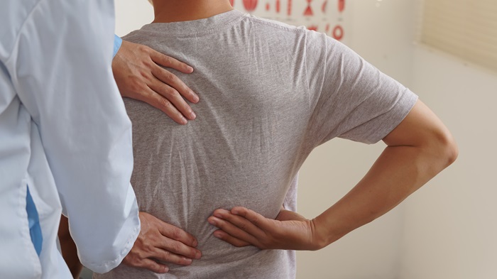 Image about Doctor checking the patient back