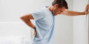 This image about man suffering from back pain 