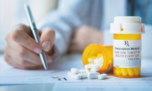 Doctor writing prescription 