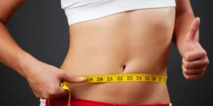women measuring waist